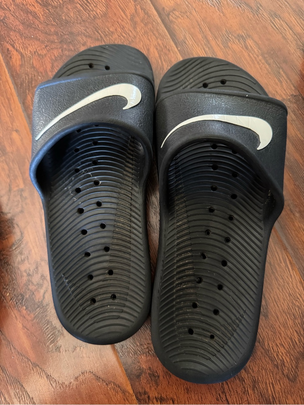 Nike Black Slide Sandals with White Swoosh Accent